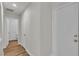 Hallway with wood-look flooring featuring a closet and access to a bathroom at 9526 Vast Valley Ave, Las Vegas, NV 89148
