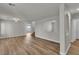 Bright, open-concept living room featuring wood-look flooring and ample natural light at 9526 Vast Valley Ave, Las Vegas, NV 89148