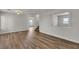 Open-concept living area featuring wood-look floors and stairway to the second floor at 9526 Vast Valley Ave, Las Vegas, NV 89148
