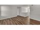 Spacious living room showcasing attractive wood-look flooring and neutral walls, perfect for modern living at 9526 Vast Valley Ave, Las Vegas, NV 89148