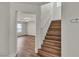 Staircase with wood-look flooring, leading to a bright and open living space at 9526 Vast Valley Ave, Las Vegas, NV 89148