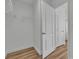 Bright walk-in closet with wire shelving, wood-look floors, and easy access to other rooms at 9526 Vast Valley Ave, Las Vegas, NV 89148
