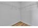 Walk-in closet with white wire shelving and wood-look floors provides ample storage space at 9526 Vast Valley Ave, Las Vegas, NV 89148