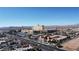 Aerial view of the neighborhood and resort with mountain backdrop at 9555 Belle Fountain Ave, Las Vegas, NV 89123