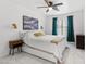 Cozy bedroom featuring a platform bed, sconce lighting, and stylish decor at 9555 Belle Fountain Ave, Las Vegas, NV 89123