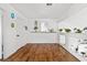Bright upstairs hallway with hardwood floors, white walls, and decorative shelving at 9555 Belle Fountain Ave, Las Vegas, NV 89123
