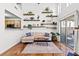 Stylish living room boasting bright lighting, decorative shelving, and a comfortable sectional sofa at 9555 Belle Fountain Ave, Las Vegas, NV 89123