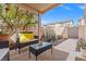 Cozy covered patio with comfortable seating and view of landscaped backyard at 9555 Belle Fountain Ave, Las Vegas, NV 89123