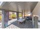 Inviting backyard patio space includes outdoor furniture, mature trees, and covered living area at 9783 Hawk Crest St, Las Vegas, NV 89141