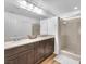 Bathroom features double sinks, a large mirror, and a glass-enclosed shower at 9783 Hawk Crest St, Las Vegas, NV 89141
