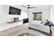 Modern bedroom featuring a ceiling fan, a TV, and a comfortable bed with stylish pillows at 9783 Hawk Crest St, Las Vegas, NV 89141