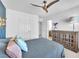 Relaxing bedroom with a charming light fixture, wooden dresser, and cool-tone decor at 9783 Hawk Crest St, Las Vegas, NV 89141