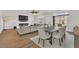 Open concept dining area features modern table and chairs with living room at 9783 Hawk Crest St, Las Vegas, NV 89141