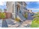 Charming home entrance with stone pathway, landscaped yard, and a welcoming front door at 9783 Hawk Crest St, Las Vegas, NV 89141