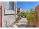 Stylish home entrance with a stone pathway, lush landscaping, and a charming front porch at 9783 Hawk Crest St, Las Vegas, NV 89141