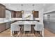 Modern kitchen with a large island, pendant lighting, and stainless steel appliances at 9783 Hawk Crest St, Las Vegas, NV 89141