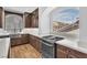 Well-lit kitchen featuring stainless steel appliances, and a large arched window at 9783 Hawk Crest St, Las Vegas, NV 89141
