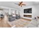 Open living area with modern fireplace, recessed lights, and ceiling fan at 9783 Hawk Crest St, Las Vegas, NV 89141