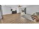 Spacious living room featuring modern tile floors, a fan, and backyard access at 9783 Hawk Crest St, Las Vegas, NV 89141