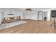 Expansive living room with stylish tile flooring, modern decor, and backyard access at 9783 Hawk Crest St, Las Vegas, NV 89141