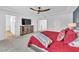 Bright primary bedroom boasting plush carpeting, a modern ceiling fan, and ample closet space at 9783 Hawk Crest St, Las Vegas, NV 89141