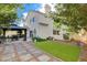A backyard showcases a gazebo, artificial turf, and a serene outdoor living space at 2864 Cape Verde Ln, Las Vegas, NV 89128