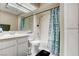 Well-lit bathroom featuring a tub with shower and granite countertop sink at 2864 Cape Verde Ln, Las Vegas, NV 89128