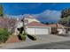 Charming two-story home featuring a red tile roof and a spacious two-car garage at 2864 Cape Verde Ln, Las Vegas, NV 89128