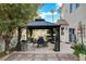 A backyard features a gazebo with an outdoor dining set at 2864 Cape Verde Ln, Las Vegas, NV 89128