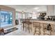Eat in kitchen features white cabinets, granite countertops, and an exit to the covered patio at 2864 Cape Verde Ln, Las Vegas, NV 89128