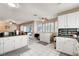 Spacious eat in kitchen with white cabinets, stainless appliances, and eat in bar at 2864 Cape Verde Ln, Las Vegas, NV 89128