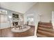 Inviting living room boasts vaulted ceilings, fireplace, and wood-look floors at 2864 Cape Verde Ln, Las Vegas, NV 89128