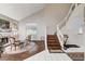 Sun-filled living room boasting vaulted ceilings, staircase, and cozy seating area at 2864 Cape Verde Ln, Las Vegas, NV 89128