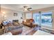 Cozy living space featuring a fireplace, comfortable seating, and sliding door to patio at 2864 Cape Verde Ln, Las Vegas, NV 89128