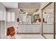 This bathroom has double sinks, tiled floors, and a large mirror at 2864 Cape Verde Ln, Las Vegas, NV 89128