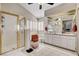 Bright main bathroom offers double sinks, a walk-in shower, and tiled floors at 2864 Cape Verde Ln, Las Vegas, NV 89128