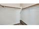 Spacious walk-in closet with ample storage space and wooden floors at 10632 Open Range Ct, Las Vegas, NV 89179