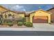 Charming single-story home featuring a terracotta tile roof and a well-manicured front yard at 10632 Open Range Ct, Las Vegas, NV 89179