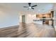 Bright open-concept space with a kitchen overlooking the living and dining area at 10632 Open Range Ct, Las Vegas, NV 89179