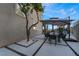 Outdoor dining space with elegant patio furniture and a built-in barbecue area, offering ample room at 1168 Spago Ln, Henderson, NV 89052