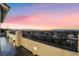 Enjoy the stunning views from this spacious balcony overlooking the city and surrounding landscape at 1168 Spago Ln, Henderson, NV 89052