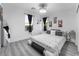 Modern bedroom featuring a unique bed frame, stylish decor, and a bright, airy ambiance at 1168 Spago Ln, Henderson, NV 89052