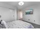 A contemporary bedroom design highlighting a sleek wardrobe, wall-mounted TV, and minimalist aesthetic at 1168 Spago Ln, Henderson, NV 89052