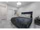 Bedroom with large bed, dark accents, light gray flooring and white walls at 1168 Spago Ln, Henderson, NV 89052