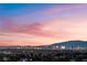 Stunning twilight skyline view of the city and mountains in the distance at 1168 Spago Ln, Henderson, NV 89052