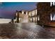 Wide brick driveway with a spacious two-car garage and ample parking at 1168 Spago Ln, Henderson, NV 89052
