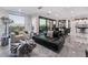 Open-concept living area with a sleek couch, stylish furniture, and great views at 1168 Spago Ln, Henderson, NV 89052
