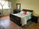 Cozy bedroom with wood floors, large window, and ample natural light at 1320 Norman Ave, Las Vegas, NV 89104