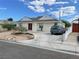 Charming single-story home featuring a long driveway and well-maintained landscaping at 1320 Norman Ave, Las Vegas, NV 89104