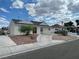 Charming single-story home with a well-maintained yard and a circular driveway in a suburban setting at 1320 Norman Ave, Las Vegas, NV 89104